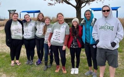 honors student volunteering at park